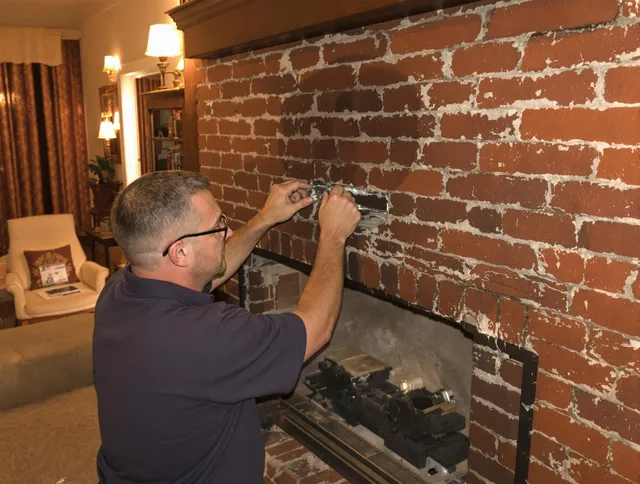 Rialto Chimney Sweep expert fixing a fireplace in Rialto, CA
